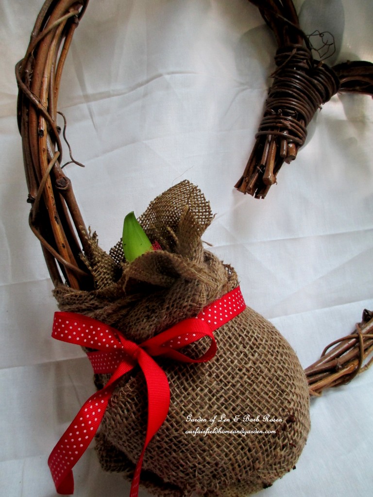 attach the burlap wrapped ball to the wreath with floral wire, then add a ribbon https://lolajack-global.jp.net/diy-amaryllis-heart-wreath/