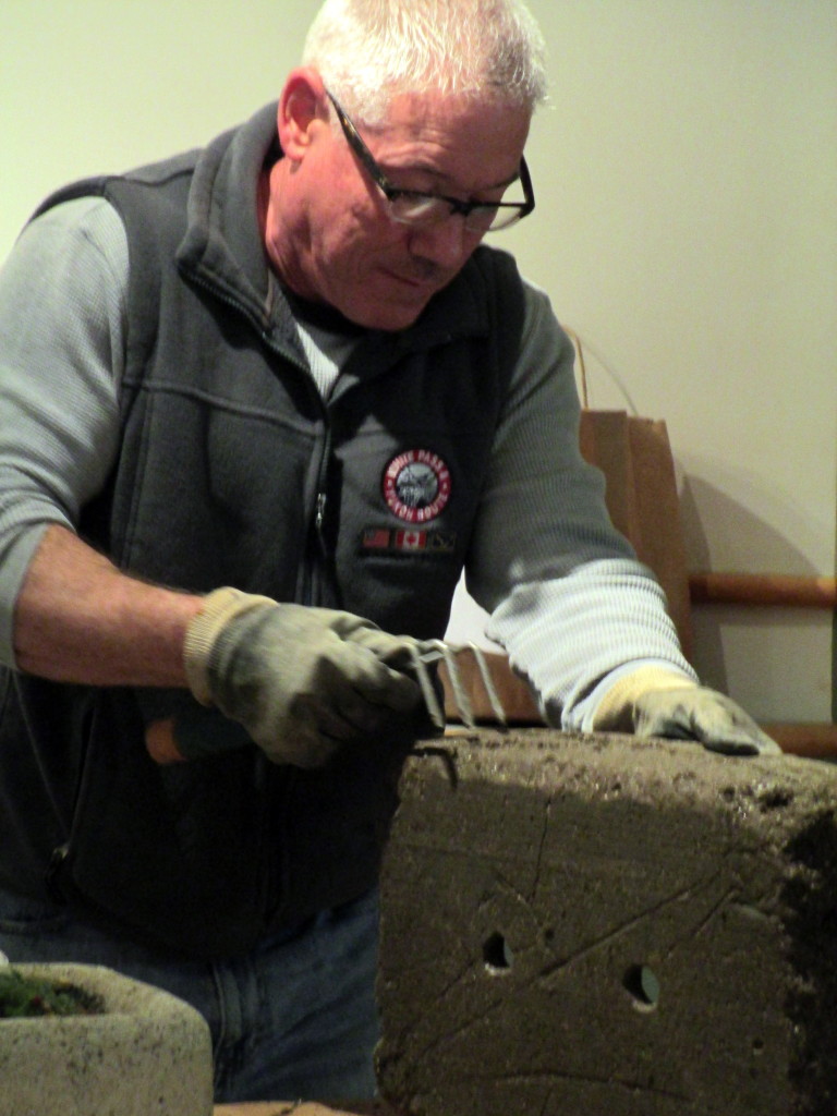 Step #  ~ After curing for three days, pop your hypertufa pot out of the mold and rough it up to make it look like natural weathering.