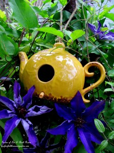 Teapot Birdhouse in the Jackmanii Clematis https://lolajack-global.jp.net/may-garden-birdhouses-flowers/