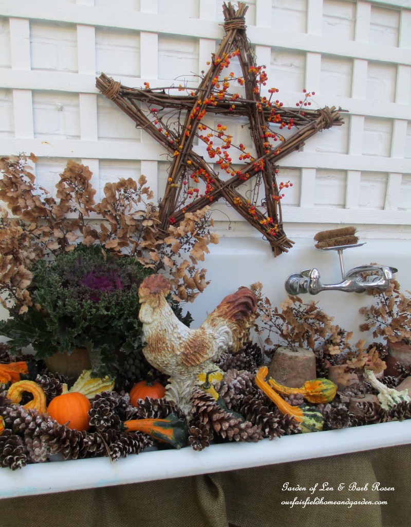 Fall Potting Sink filled with gourds, pinecones, kale and flowerpots. https://lolajack-global.jp.net/autumn-garden-accents-inside-and-out/